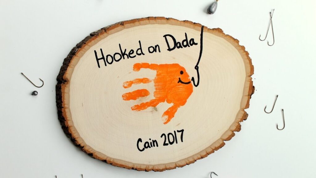 Hooked on Dada Wood Slice Craft - Cute Father's Day Handprint Crafts